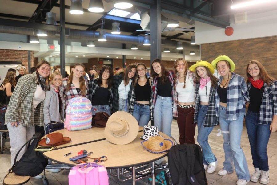 Varsity girls tennis dressing up as cowgirls for their match against Fox Lane.