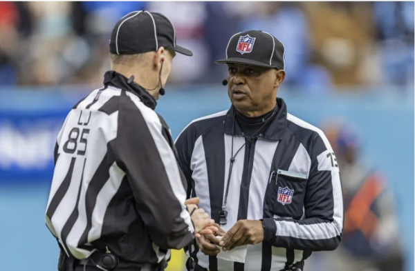  Down Judge Patrick Turner (13) Talks with Line Judge Daniel Gallagher (85) during an NFL Football Game between the Jacksonville Jaguars and the Tennessee Titans.